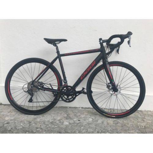 Bicicleta 700 Oggi Speed Velloce Disc 16V (2019) + Capacete + Pisca Led + Farol